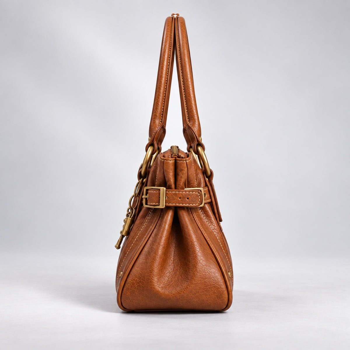 The Clea Bag — Cognac, side view